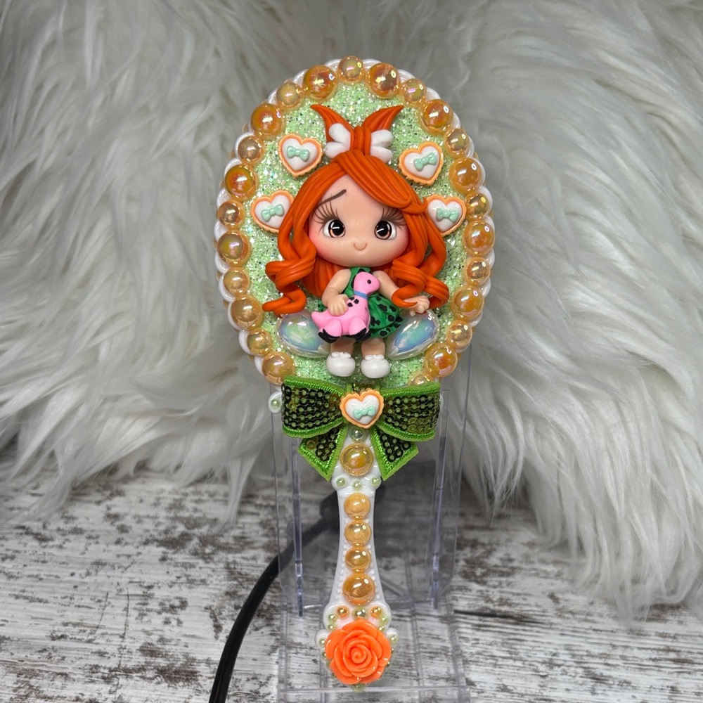 Pebbles Decorative Hand Mirror with Orange Accents
